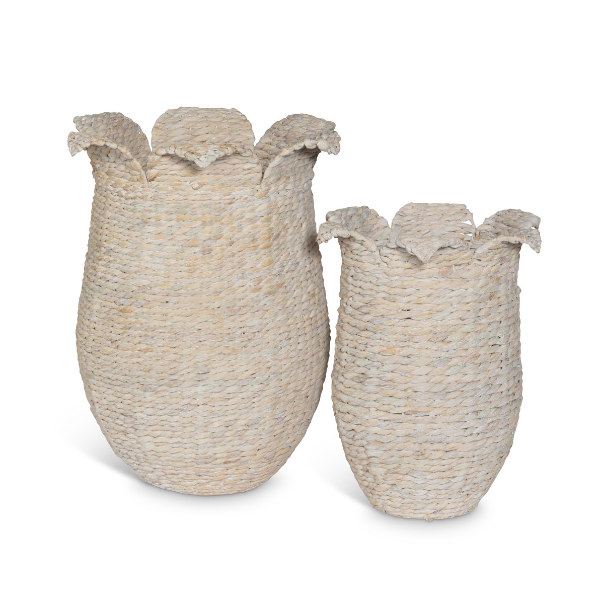 Two graduated whitewashed woven baskets with rounded bodies and petal-shaped rims