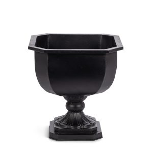 An iron chalice planter in Noir, with an octagonal rim, rounded bowl and fluted pedestal.